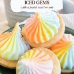 A small bowl of Iced Gems featuring shortbread cookies topped with swirls of pastel-colored icing.